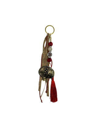 Charm with decorative metallic pomegranate