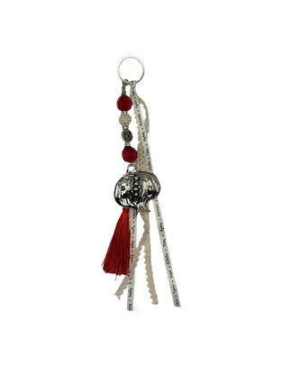 Charm with decorative metallic pomegranate