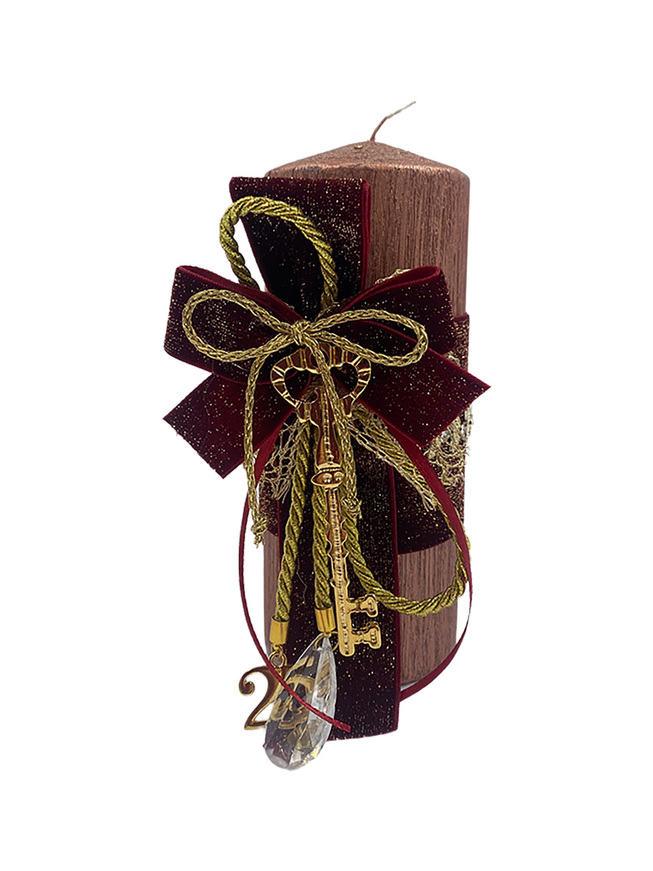 Decorative candle with key metal element