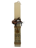 Candle with a metal piano scraper